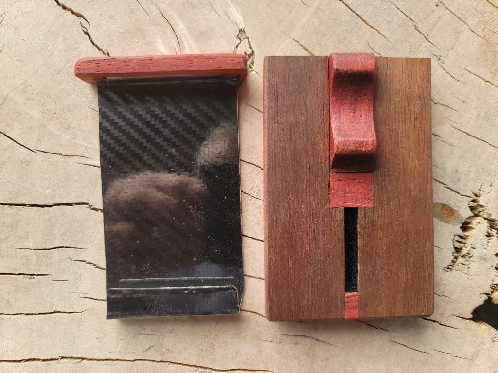 North 44 wallet opened from above, carbon-fiber card tray beside the wooden shell
